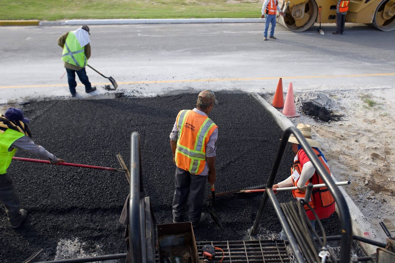 commercial asphalt repair contractor patching school parking lot 
